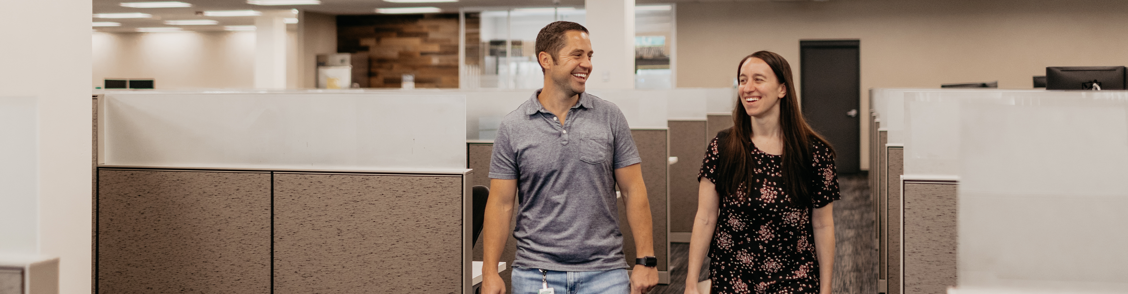 Two COUNTRY Financial employees walking and talking together