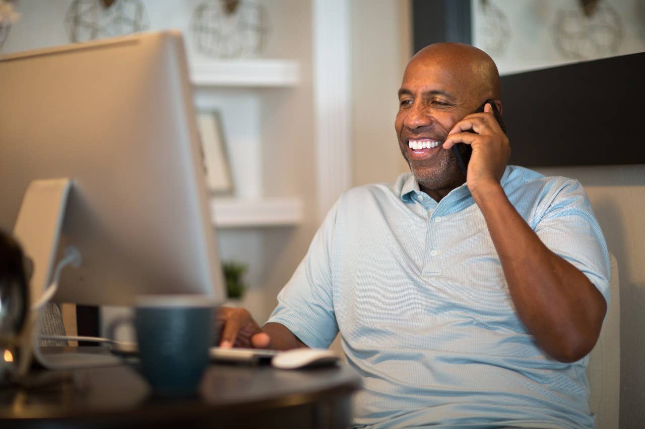 African American man working from his home office.