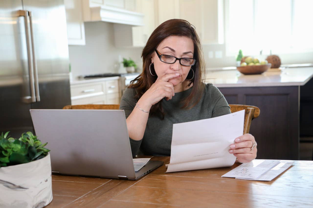 Woman researching at her home computer.