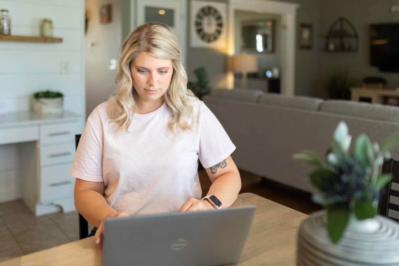 Woman on laptop in dinning room