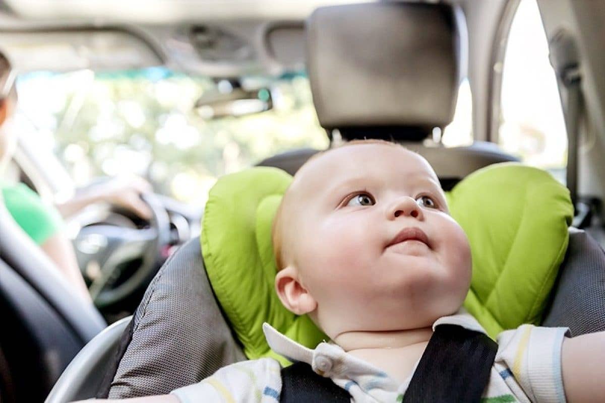 Baby in car seat in back of car