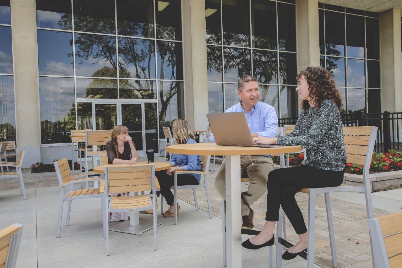 Coworkers sitting on patio